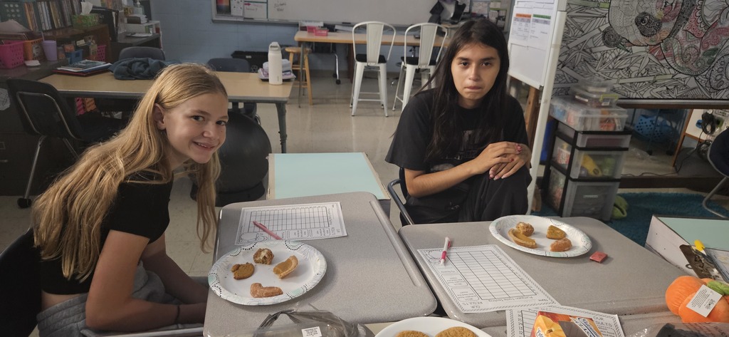 Students tasting different pumpkin flavored treats.