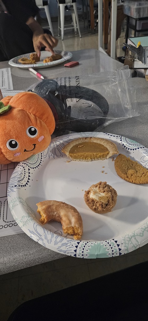 Students tasting different pumpkin flavored treats.