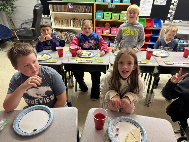 Students enjoying the food from the book!