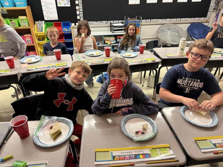 Students enjoying the food from the book!