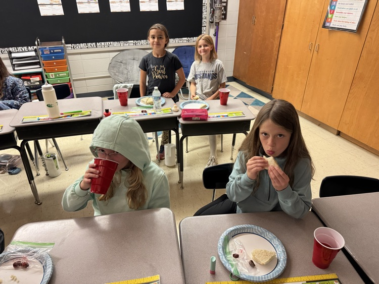 Students enjoying the food from the book!