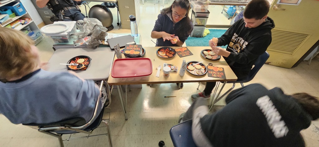 Students decorating cookies.