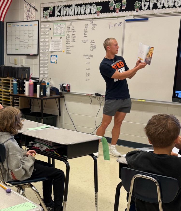 Zane reading a book to 5BR