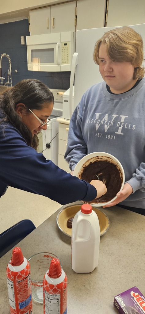 Students making a pie.