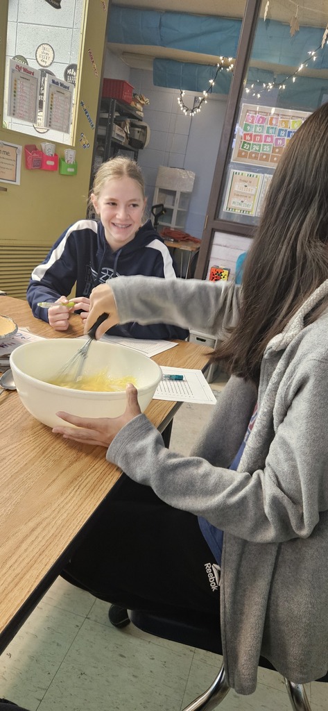 Students making a pie.