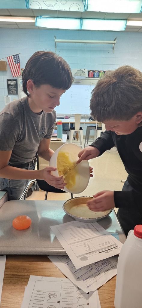 Students making a pie.