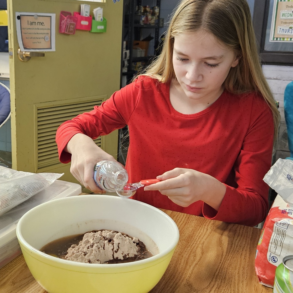 Students making brownies.