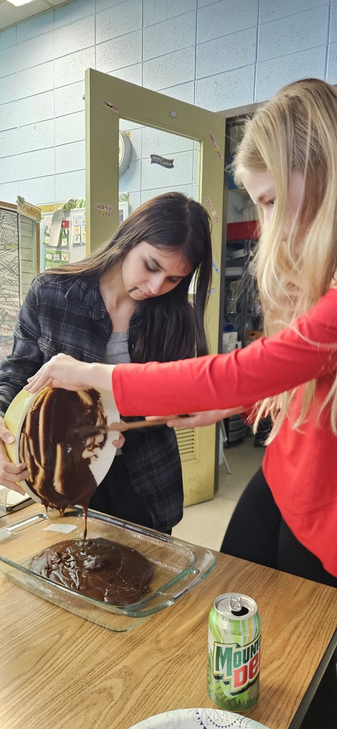 Students making brownies.
