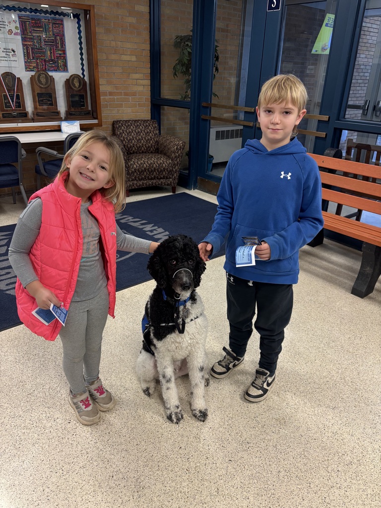 Facility dog and two prize winners