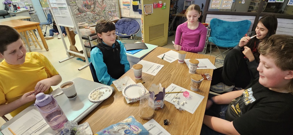 Students making hot chocolate.