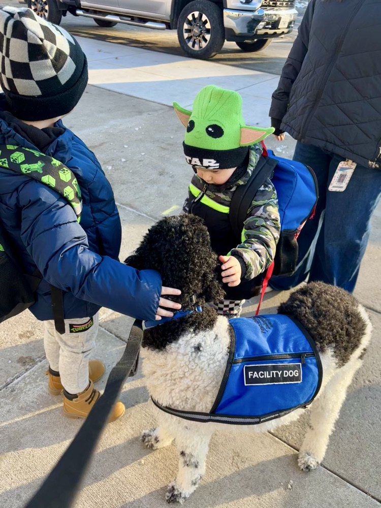 Marshall greeting kids at student drop off