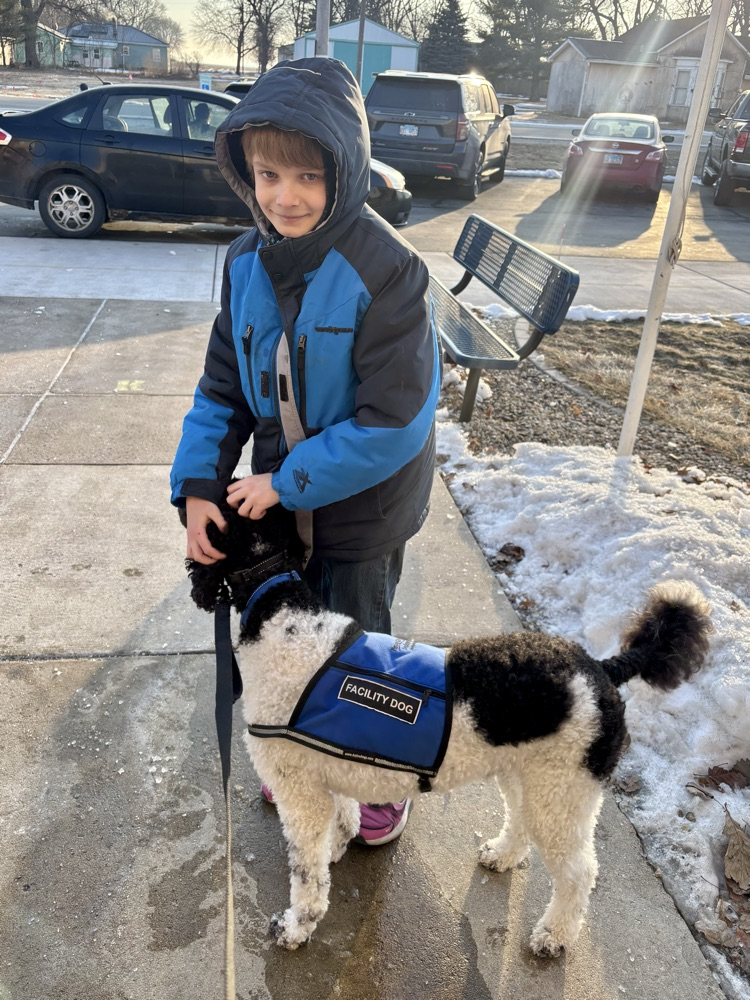 Marshall greeting kids at drop off 