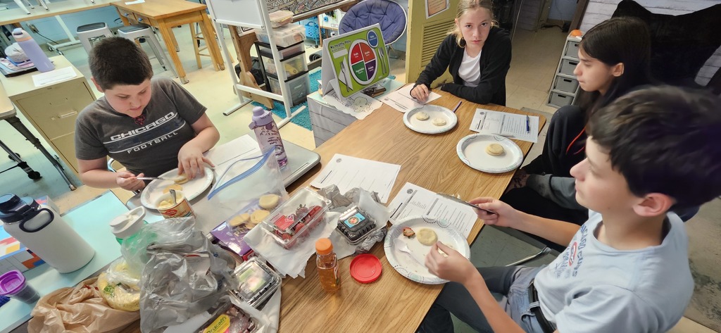 Students making fruit pizza.