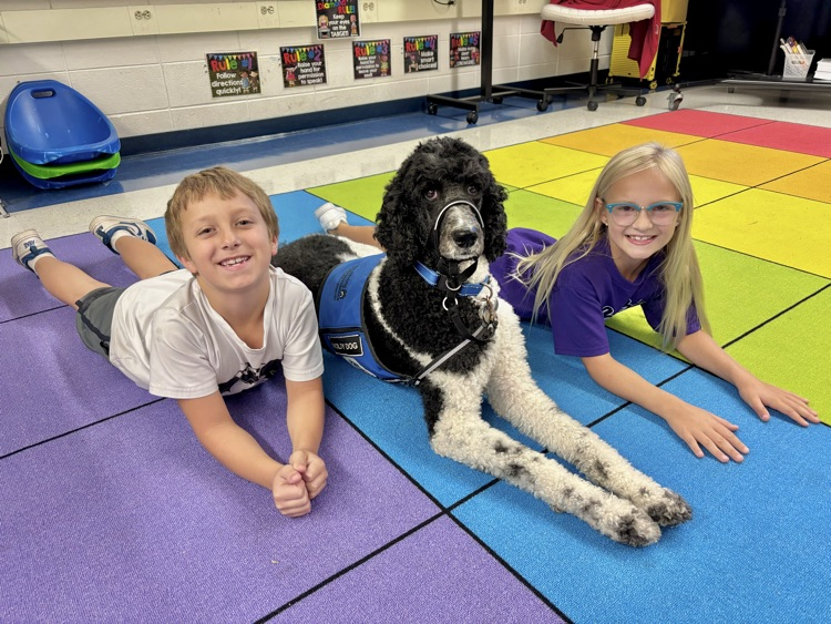 student with facility dog