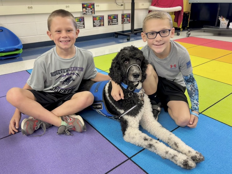 student with facility dog
