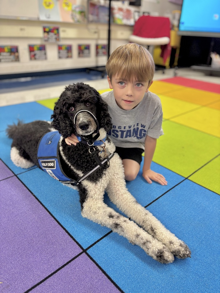 student with facility dog