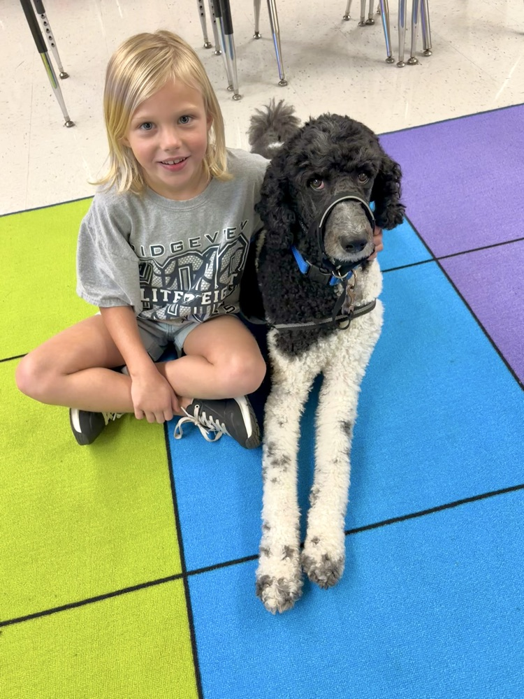 student with facility dog