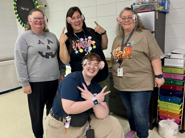 teachers wearing principals face stickers