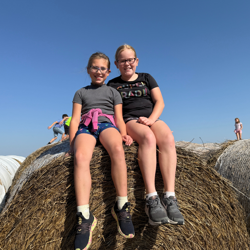 Friends on bales.
