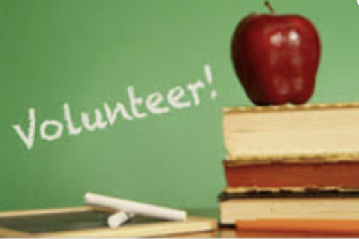 Volunteer! apple on a stack of books