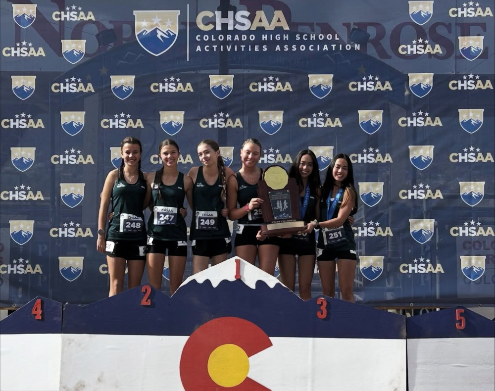 CHSAA 2A HS Cross Country team on podium.