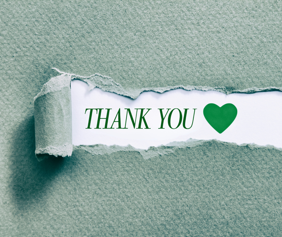 Green torn paper revealing the words “THANK YOU” with a green heart.