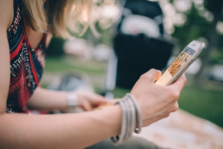 Girl with mobile device in her hand