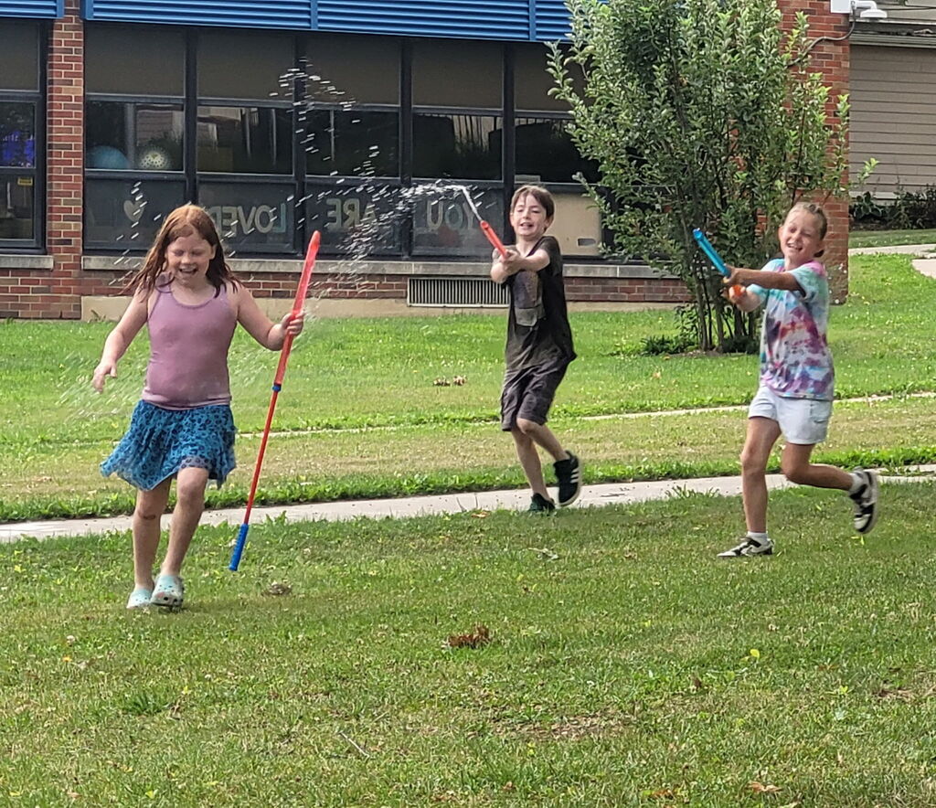 Kids playing water wars