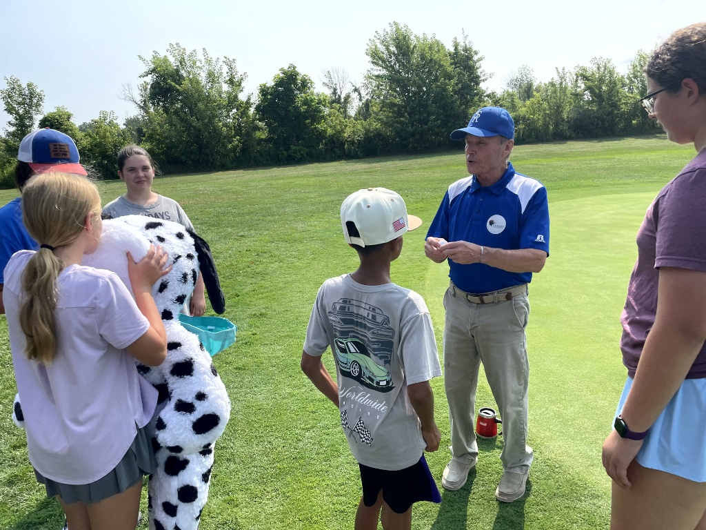 students listening to lesson - golf