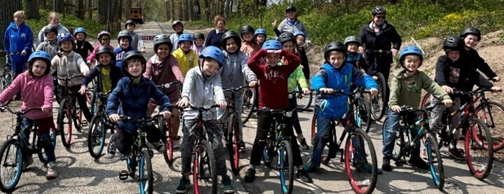 3rd Graders riding bike for their Spring Adventure at Presque Isle State Park 