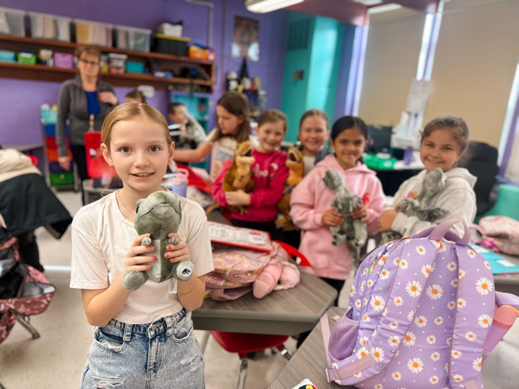 3rd grade students displaying their dinosaur from Dino surprise day