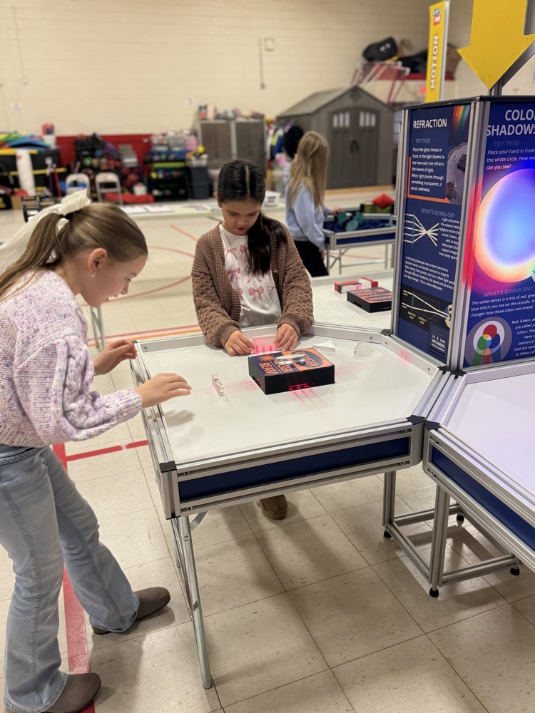 students working at the refraction pod of the unit 