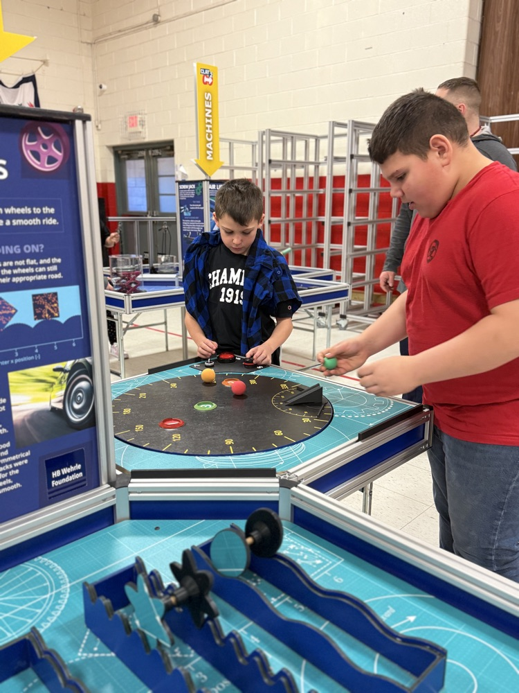 students working at a STEAM pod 