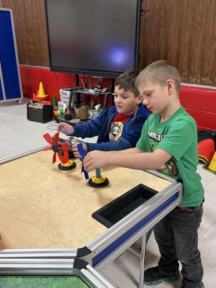 students working at the steam pod for wind turbines 
