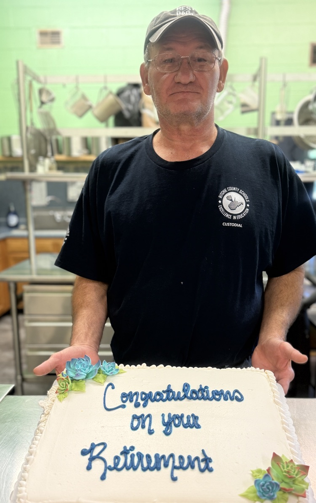 Mr keener head custodian pictured with his retirement cake