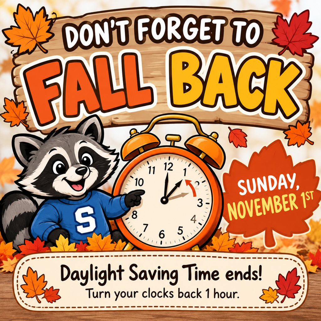 A colorful fall-themed reminder graphic featuring Raider the Raccoon wearing a blue sweatshirt with a white letter S, standing beside a large orange alarm clock. The background features autumn leaves in shades of orange, red, and yellow, along with a wooden sign displaying the words “DON’T FORGET TO FALL BACK.” A large orange leaf reads “SUNDAY, NOVEMBER 1ST.” At the bottom, a banner states, “Daylight Saving Time ends! Turn your clocks back 1 hour.”