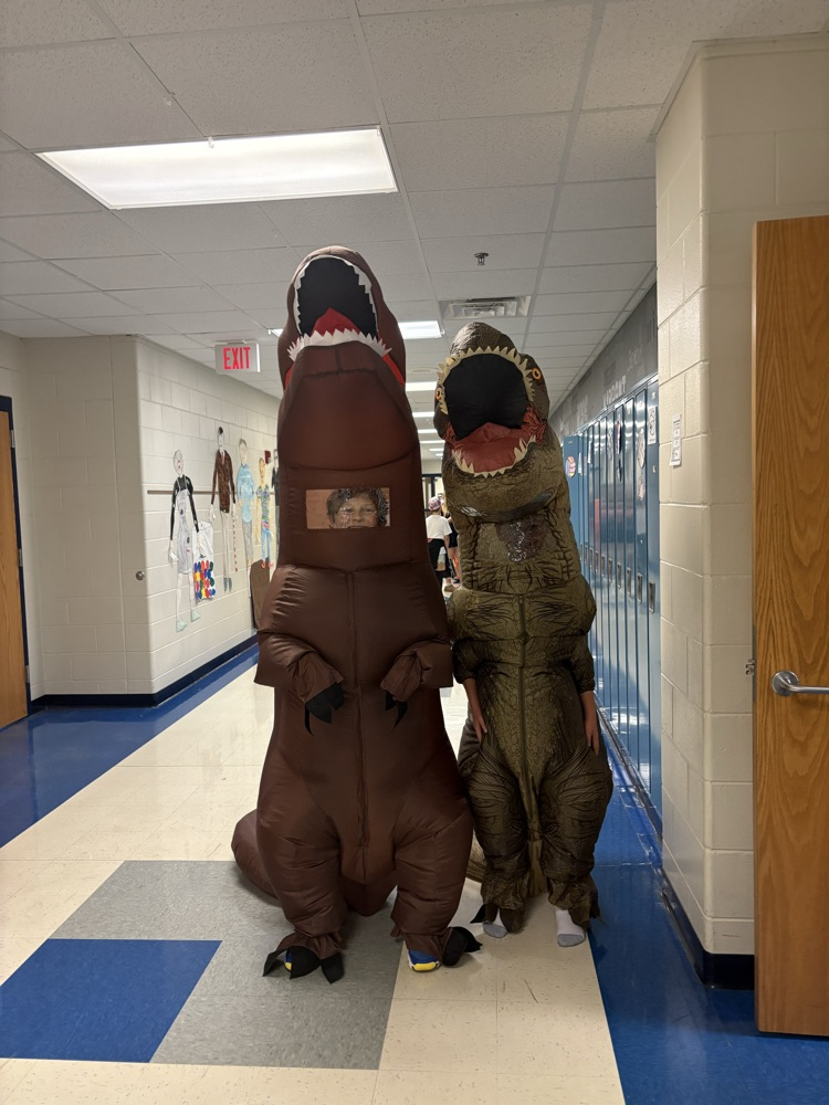 Students in dinosaur costumes 