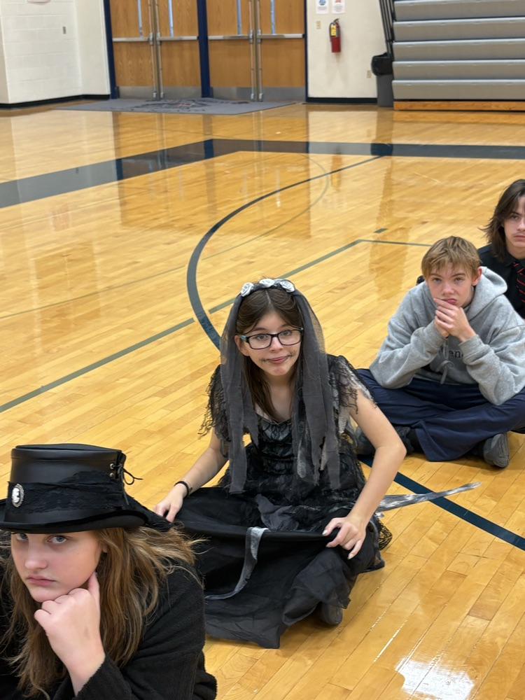 8th graders waiting to play a game.