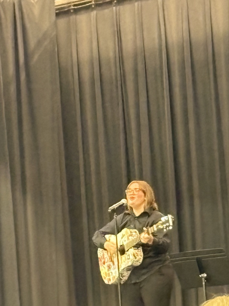 Natalie playing the guitar.
