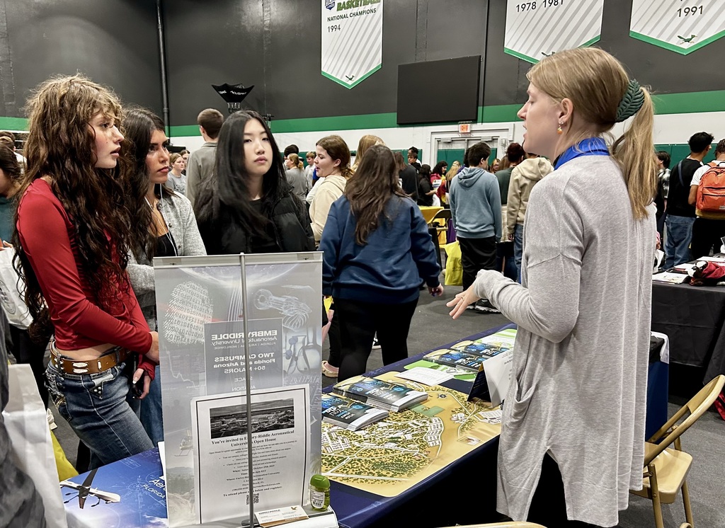 Students meeting with a representative from a college. 