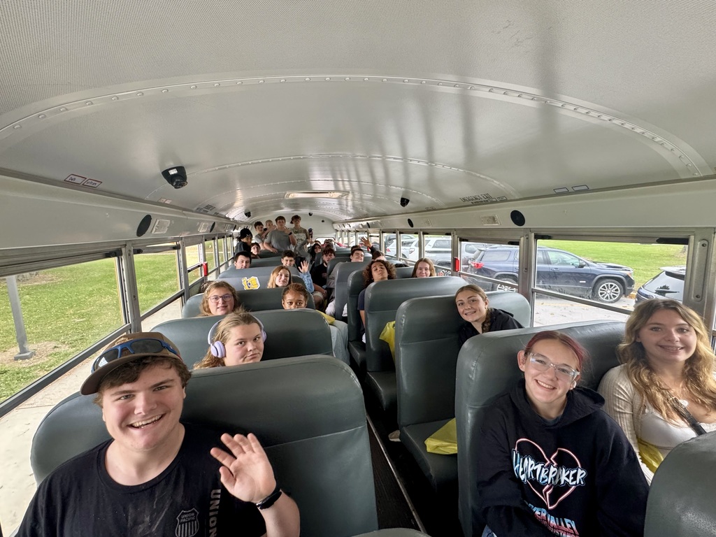 Students on a bus going to a college fair. 
