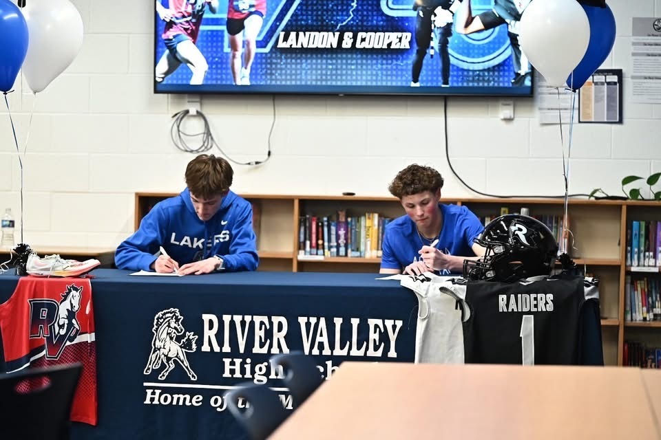Landon and Cooper signing