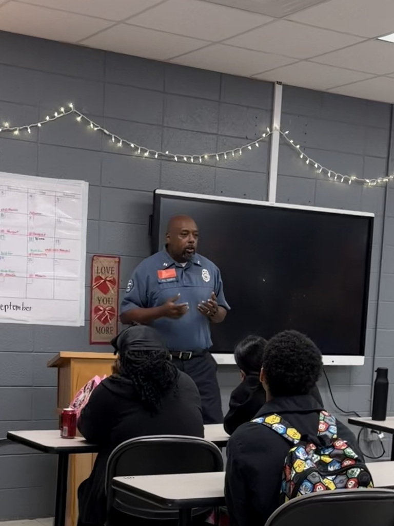 presenter speaking to students