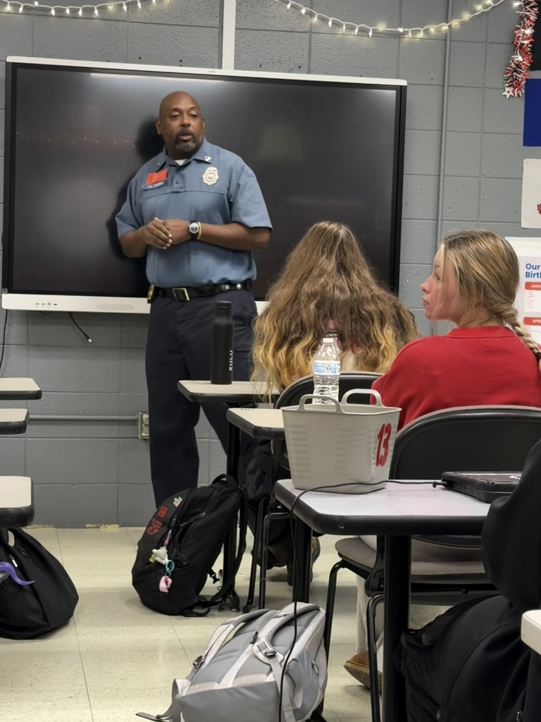 presenter speaking to students
