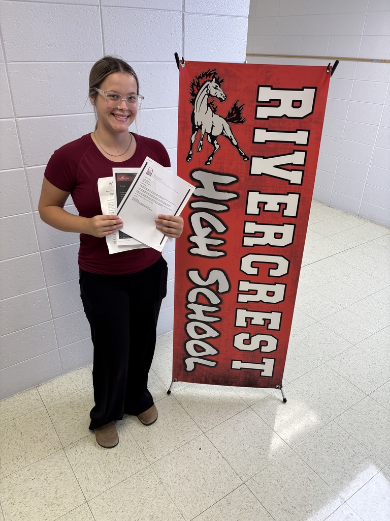 Girl holding college acceptance letters.