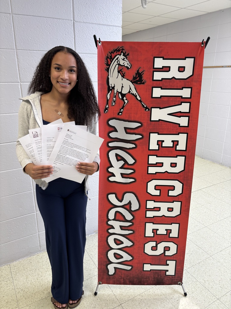 girl holding college acceptance letters