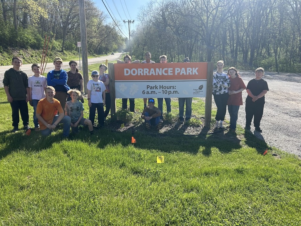 students standing near a sign for Dorrance Park