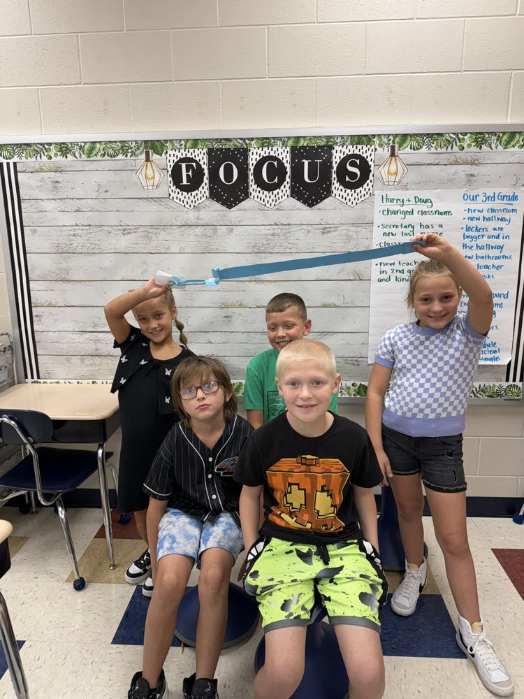 students with their completed leash