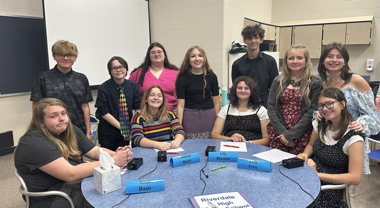 photo of Quiz Bowl team around round table