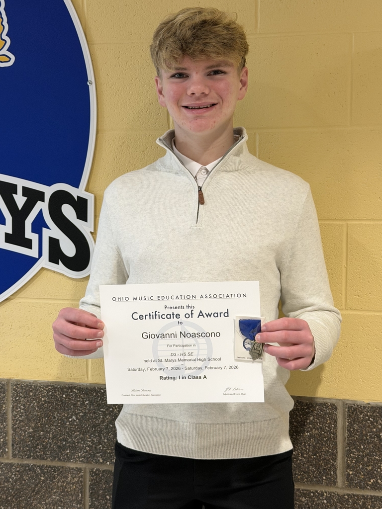 Gio holding his award 